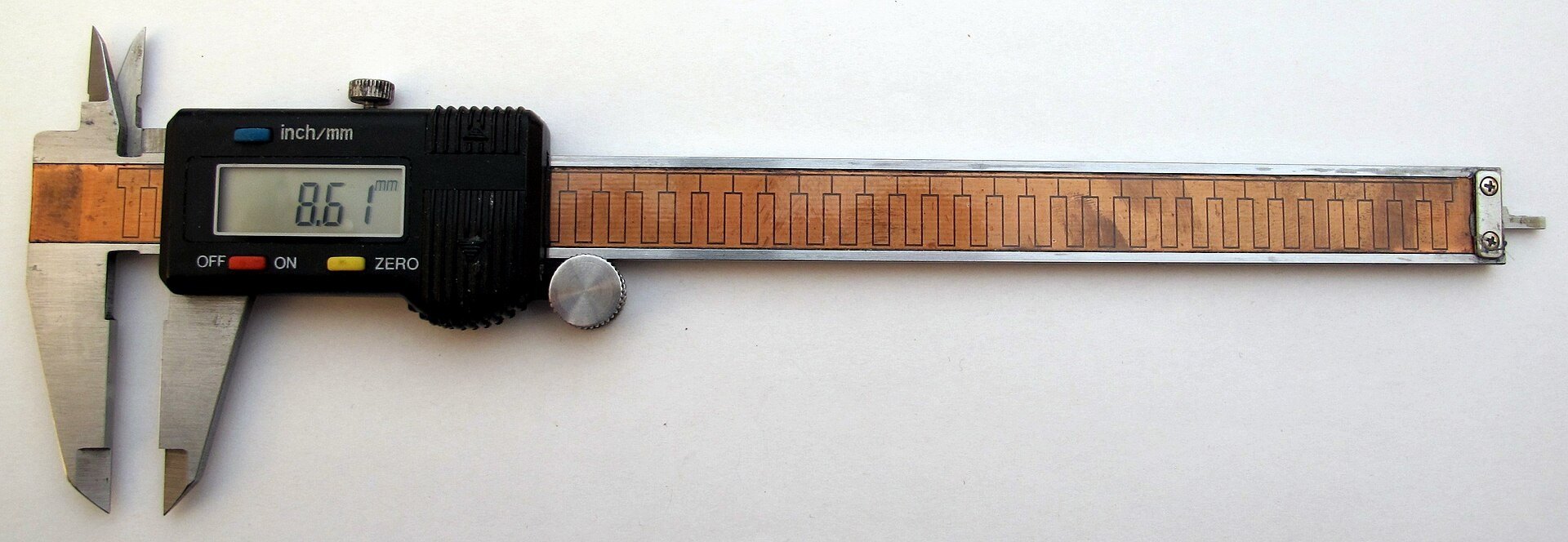 Precision caliper measurement — verifying 0.03 µm linear accuracy